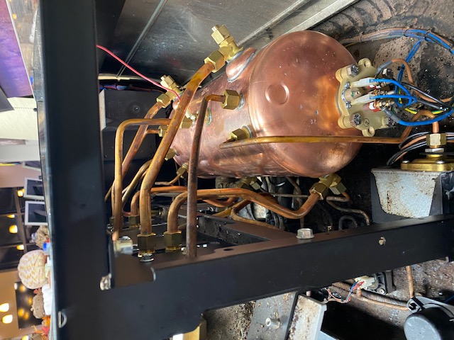 Espresso machine boiler and plumbing components during inspection